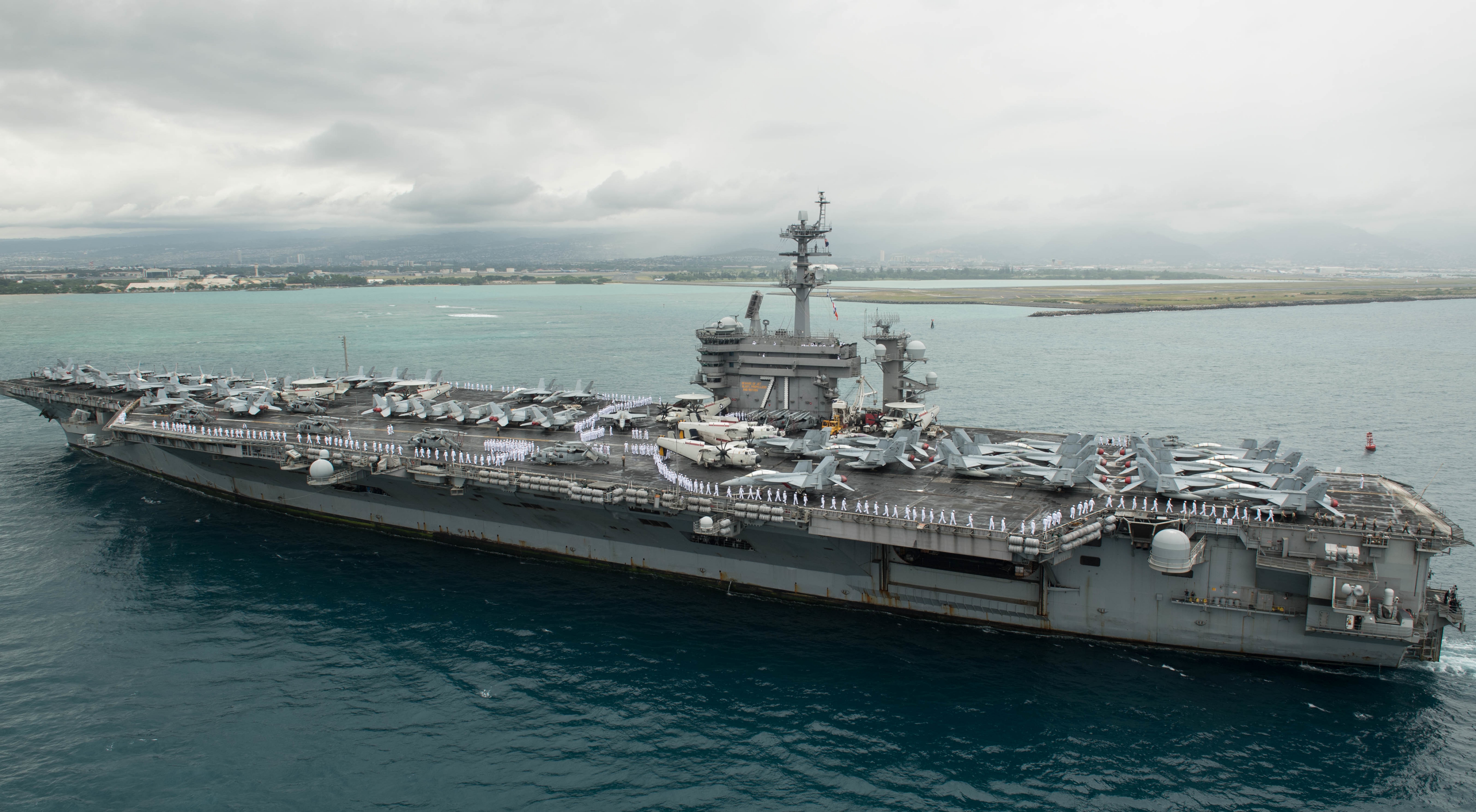 Aircraft carrier USS Theodore Roosevelt (CVN 71) arrives in Pearl Harbor, Hawaii, April 27, 2018. Image courtesy Petty Officer 3rd Class Jessica Blackwell / Navy Public Affairs Support Element Detachment Hawaii. (Photo by Smith Collection/Gado/Getty Images)