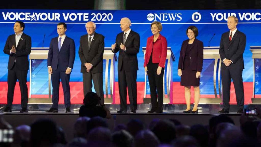 2020 Democratic presidential candidates, from left, tech entrepreneur Andrew Yang; former South Bend, Indiana Mayor Pete Buttigieg; Sen. Bernie Sanders, I-Vt., former Vice President Joe Biden; Sen. Elizabeth Warren, D-Mass.; Sen. Amy Klobuchar, D-Minn.;, and Tom Steyer, a billionaire philanthropist, arrive on stage during the Democratic presidential debate at Saint Anselm College in Manchester, New Hampshire on Friday, Feb. 7, 2020. The New Hampshire debates often mark a turning point in a presidential campaign, as the field of candidates is winnowed and voters begin to pay closer attention.