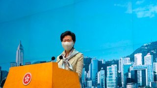 Hong Kong Chief Executive Carrie Lam listens to reporters' questions during a press conference in Hong Kong, Tuesday, June 30, 2020. Hong Kong media are reporting that China has approved a contentious law that would allow authorities to crack down on subversive and secessionist activity in Hong Kong, sparking fears that it would be used to curb opposition voices in the semi-autonomous territory.