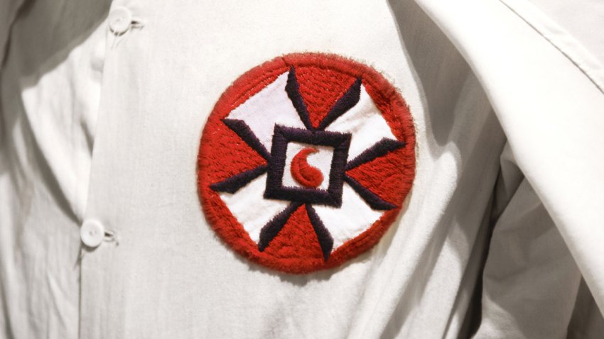 WHITE SUPREMACY RACIST KU KLUX KLAN MEMBER IN WHITE ROBE AND HOO