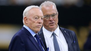 Owner Jerry Jones of the Dallas Cowboys and Executive Vice President Stephen Jones talk before a game against the New Orleans Saints at the Mercedes Benz Superdome on Sept. 29, 2019 in New Orleans, Louisiana.