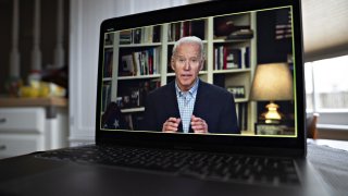 In this March 25, 2020, file photo, former Vice President Joe Biden, 2020 Democratic presidential candidate, speaks during a virtual press briefing on a laptop computer in this arranged photograph in Arlington, Virginia.