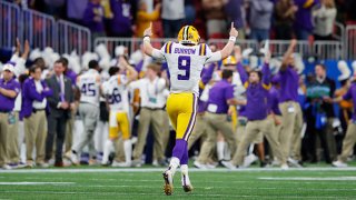 Quarterback Joe Burrow #9 of the LSU Tigers celebrates a touchdown in the third quarter over the Oklahoma Sooners during the Chick-fil-A Peach Bowl at Mercedes-Benz Stadium on Dec. 28, 2019 in Atlanta, Georgia.