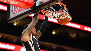 John Collins #20 of the Atlanta Hawks dunks during the second half of an NBA game against the Dallas Mavericks at State Farm Arena on Feb. 22, 2020 in Atlanta, Georgia.