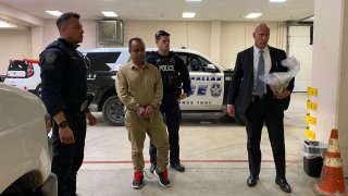 Jose Sifuentes is escorted by Dallas police officers on Wednesday, Jan. 8, 2020.