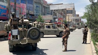 Afghan security personnel arrive at the site where gunmen attacked in Kabul, Afghanistan, Tuesday, May 12, 2020.