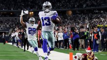 Michael Gallup #13 of the Dallas Cowboys scores a touchdown in the third quarter against the Washington Redskins in the game at AT&T Stadium on Dec. 29, 2019 in Arlington, Texas.