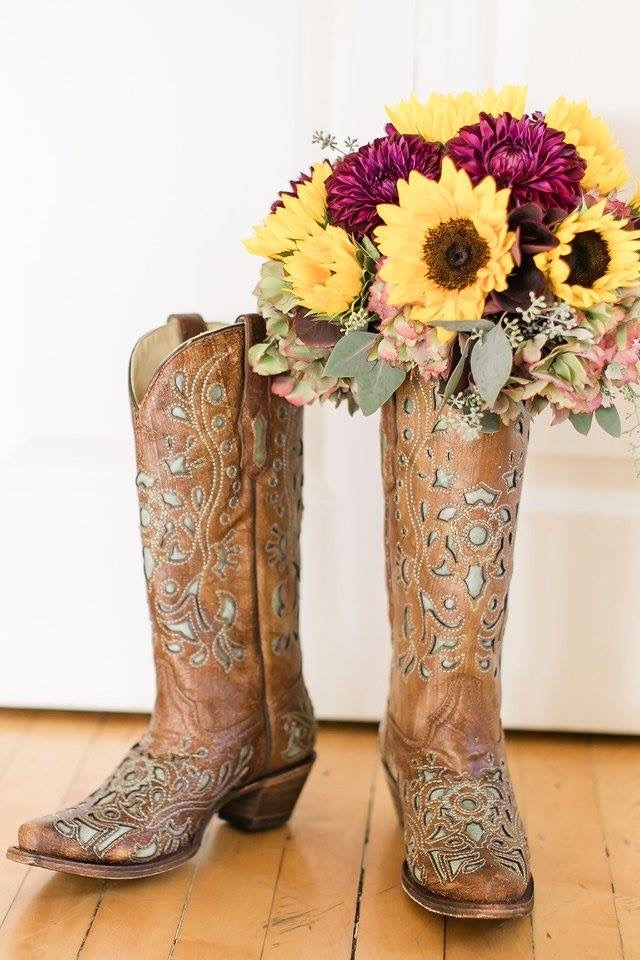 cowboy boots with flowers in them