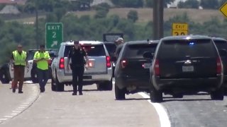 An officer was hospitalized Saturday after he was struck by a vehicle while placing out stop sticks during a pursuit, Fort Worth police say.