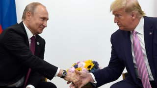 In this June 28, 2019, file photo, President Donald Trump shakes hands with Russian President Vladimir Putin during a bilateral meeting on the sidelines of the G-20 summit in Osaka, Japan.