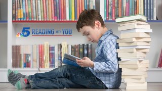 boy reading bookish library