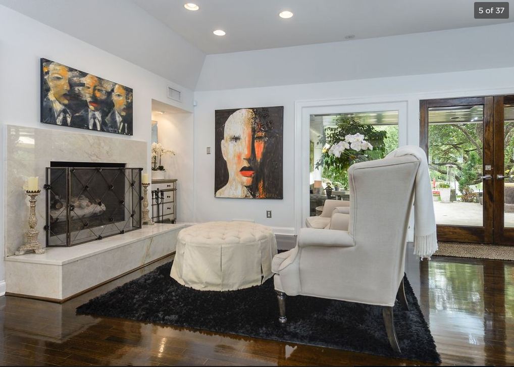 Collection of seven paintings by David Harouni. Two of the seven pieces can be seen in this photo of Leonard's living room. The interior shots were shared publicly when the home was put up for sale.