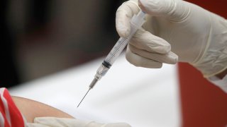 A patient receives a flu vaccination in Mesquite, Texas, on Jan. 23, 2020.