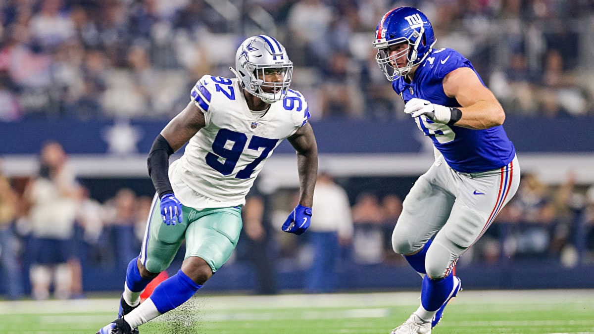 Dallas Cowboys defensive end Taco Charlton (97) walks off the