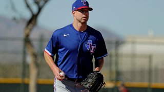 Texas Rangers pitcher Corey Kluber participates in a drill during spring training baseball practice Friday, Feb. 14, 2020, in Surprise, Arizona.