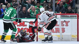 Tyler Seguin #91 of the Dallas Stars lifts a puck in for a goal in tight against Corey Crawford #50 of the Chicago Blackhawks at the American Airlines Center on Feb. 23, 2020 in Dallas, Texas.