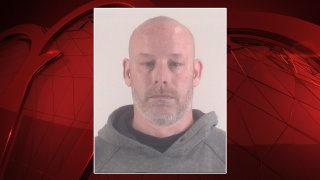 A Grapevine police news release said 45-year-old Anthony Clark is held Monday in the Tarrant County Jail on $75,000 bond, or $25,000 for each charge he faces.
