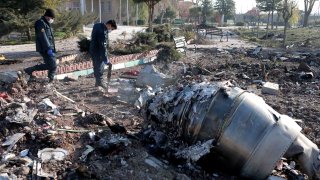 Rescuers work at the air crash site of a Boeing 737 Ukrainian passenger plane in Parand district, southern Tehran, Iran, on Jan. 8, 2020.