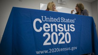 U.S. Census Bureau signage is displayed at a booth during a job fair for Hispanic professionals in Miami, Florida, U.S., on Wednesday, March 11, 2020. The Department of Labor is scheduled to release initial jobless claims figures on March 19.