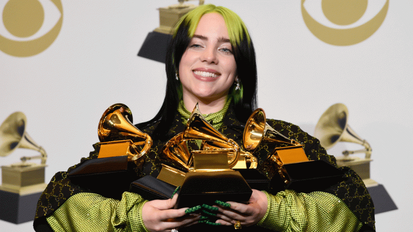 In this file photo, Billie Eilish poses in the press room with the awards for best album and best pop vocal album for "We All Fall Asleep, Where Do We Go?", best song and record for "Bad Guy" and best new artist at the 62nd annual Grammy Awards at the Staples Center on Sunday, Jan. 26, 2020, in Los Angeles.