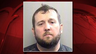 Pastor Brett Monroe arrested on charges relating to child pornography, Arlington police say.