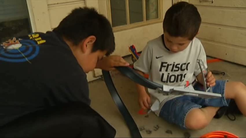 brothers play with toys