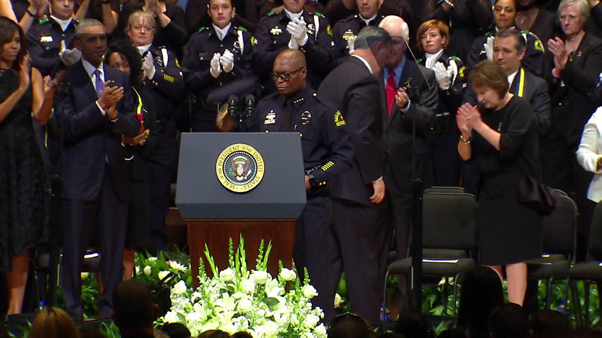 Dallas Police Chief David Brown receives a very warm welcome at the memorial service.