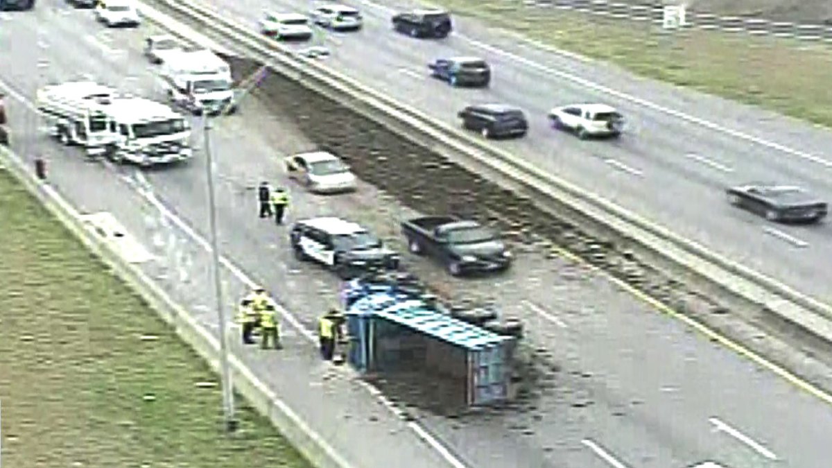 Overturned Dump Truck Spills Debris Across Interstate 30 in West Fort