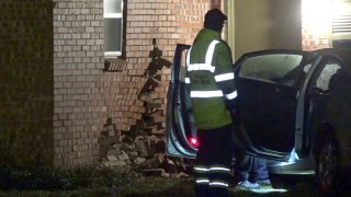 A woman is in custody Thursday morning after crashing her car into a Fort Worth home and trying to run away, police say.