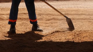 Construction worker with shovel.