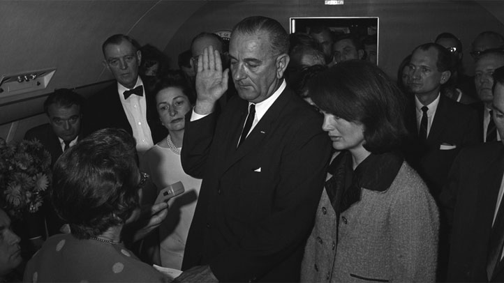 Lyndon B. Johnson is sworn in as the 36th president of the United States aboard Air Force One at Dallas Love Field following the assassination of President John F. Kennedy.