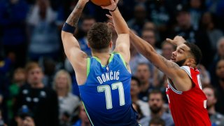 Sacramento Kings guard Cory Joseph (9) guards Dallas Mavericks forward Luka Doncic (77) during the second half of a NBA matchup between the Dallas Mavericks and the Sacramento Kings on Sunday, Dec. 8, 2019 at American Airlines Center in Dallas.