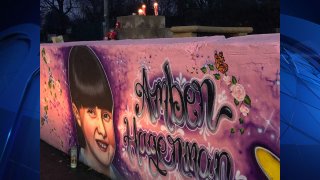 Mourners spent Monday evening at a special mural in Arlington that honors the Arlington girl whose abduction and murder led to the worldwide Amber Alert notification system to find missing children.