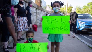 Issac and Elena Onyango, 6, from Mattapan, Mass. at a Black Lives Matter vigil in West Roxbury on Monday, June 8, 2020.