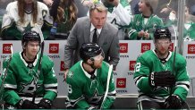 Interim coach Rick Bowness of the Dallas Stars talks with Joe Pavelski #16 during play against the New Jersey Devils in the third period at American Airlines Center on Dec. 10, 2019 in Dallas, Texas.