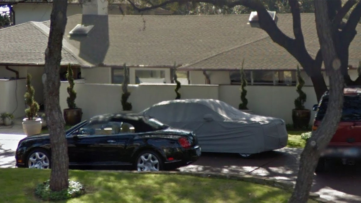 A 2008 Bentley Continental GT, VIN SCBD33W58C057347, seen in this photo parked in front of Leonard's one-time Dallas home.