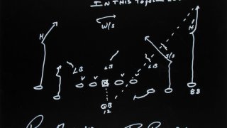 Roger Staubach captured the design of the famous Hail Mary play in chalk. He and receiver Drew Pearson, who caught the pass, signed the piece for the “In This Together" charity auction, benefiting the North Texas Food Bank.