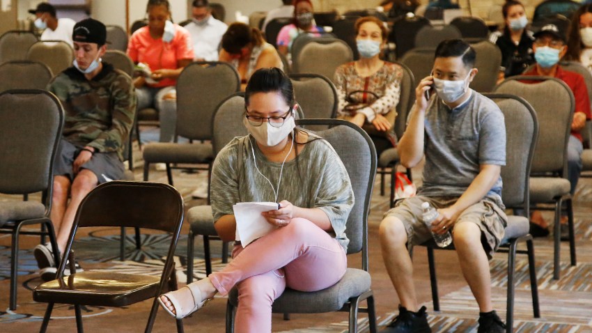 People wait to speak with representatives from the Oklahoma Employment Security Commission about unemployment claims Thursday, July 9, 2020, in Midwest City, Okla.