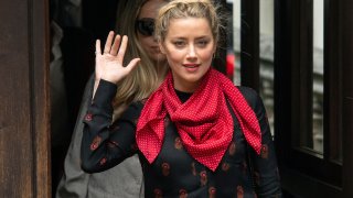 Actress Amber Heard gestures as she arrives at the High Court for a hearing in Johnny Depp's libel case, in London, Wednesday July 15, 2020. Depp is suing News Group Newspapers, publisher of The Sun, and the paper’s executive editor, Dan Wootton, over an April 2018 article that called him a “wife-beater.” The Sun’s defense relies on a total of 14 allegations by Heard of Depp’s violence. He strongly denies all of them.