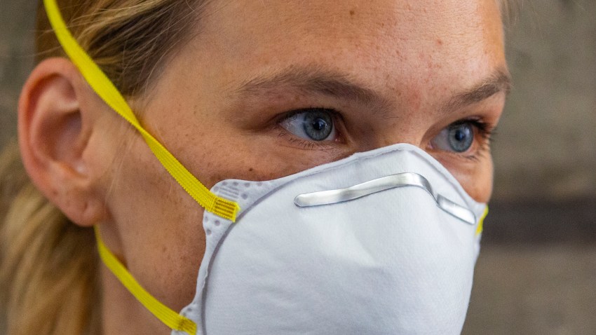 Israeli top model Bar Refaeli wears a face mask as she arrives to a court, in Tel Aviv, Israel