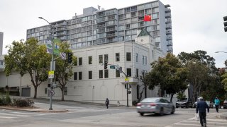 Pedestrians walk past the China Consulate General building in San Francisco, Calif., July 23, 2020.