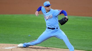 Corey Kluber (28) of the Texas Rangers pitches against the Colorado Rockies in the top of the first inning at Globe Life Field on July 26, 2020 in Arlington, Texas.