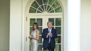 U.S. President Donald Trump and First Lady Melania Trump, left, exit after a Presidential Recognition Ceremony in the Rose Garden of the White House in Washington, D.C., U.S., on Friday, May 15, 2020.