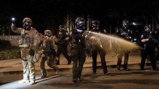 Federal officers use tear gas and other crowd dispersal munitions on protesters outside the Multnomah County Justice Center on July 17, 2020 in Portland, Oregon. Federal law enforcement agencies attempt to intervene as protests continue in Portland.