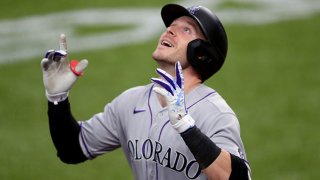 Trevor Story (27) of the Colorado Rockies celebrates after hitting a two-run home run in the top of the fourth inning against the Texas Rangers at Globe Life Field on July 26, 2020 in Arlington, Texas.