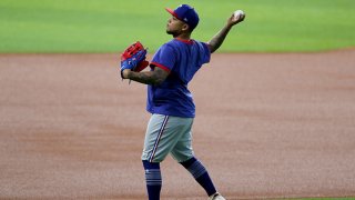 Willie Calhoun #5 of the Texas Rangers warms up during Major League Baseball Summer Workouts at Globe Life Field on July 3, 2020 in Arlington, Texas.