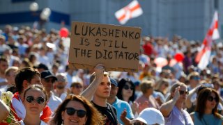 Belarusian opposition supporters rally in the center of Minsk, Belarus, Sunday, Aug. 16, 2020