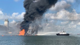 Coast Guard crews respond to a dredge on fire in the Port of Corpus Christi Ship Channel