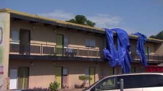 Hurst Fire Chief David Palla said the tarp had been covering an ongoing roof repair and it had been blown over to one side letting rain into the upstairs apartments and lower units.