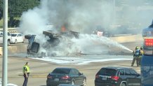 A vehicle flipped over and caught fire in the northbound lanes of US 75 in Richardson Wednesday morning.